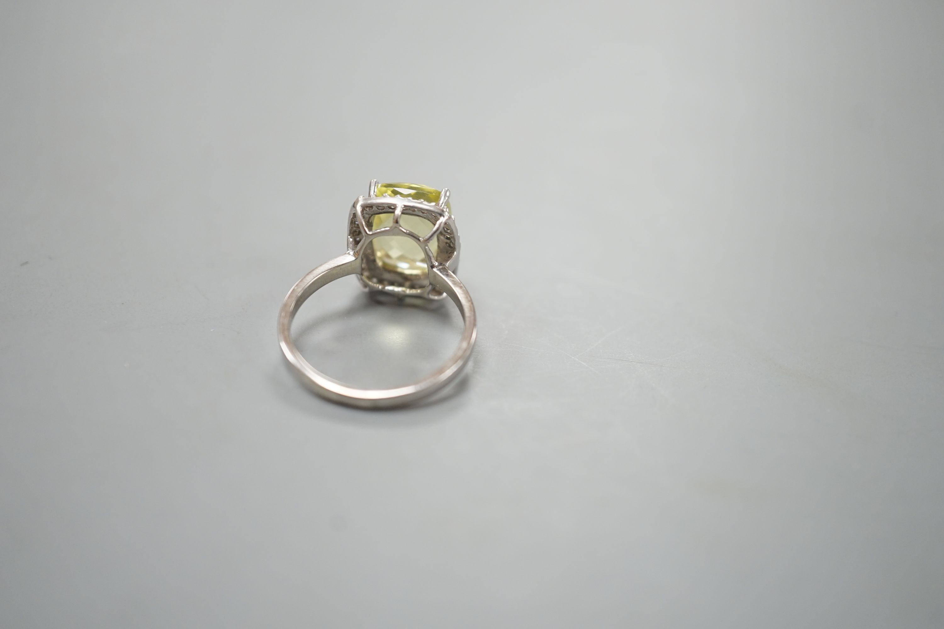 A modern 18ct white gold, fancy cut citrine and diamond cluster set dress ring, size M, gross weight 4.3 grams.